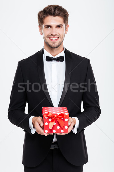 Businessman with gift Stock photo © deandrobot