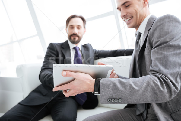 Two business partners talking in office Stock photo © deandrobot