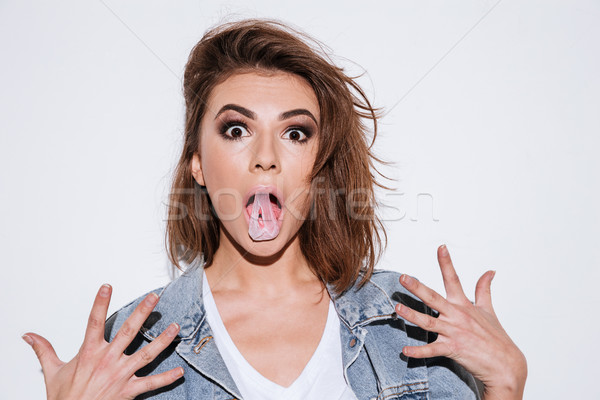 Shocked lady with bubble gum. Stock photo © deandrobot