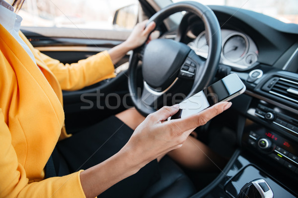 Genç kadın sürücü dokunmatik ekran el Stok fotoğraf © deandrobot