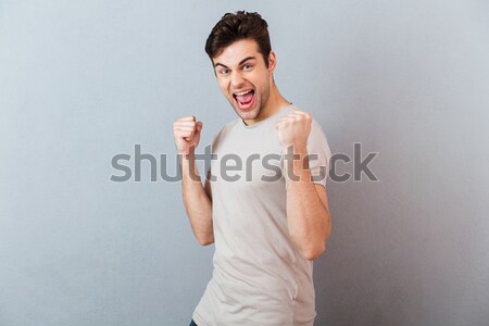 нервный надеющийся молодым человеком изображение серый футболки Сток-фото © deandrobot