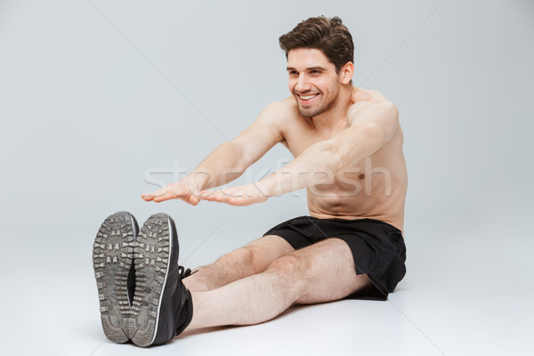 Portret uśmiechnięty młodych nago sportowiec Zdjęcia stock © deandrobot