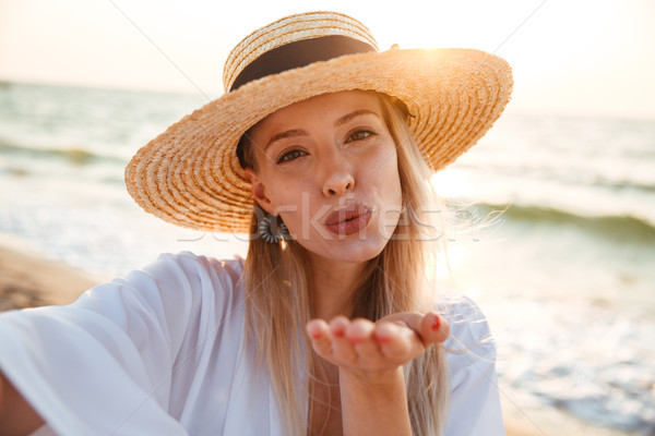 Stock photo: Delighted young girl in summer hat and swimwear