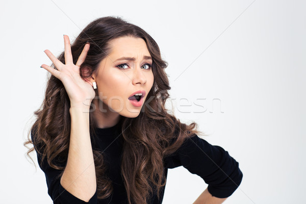 Girl with hand on ea Stock photo © deandrobot