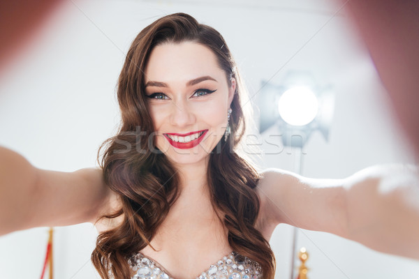 Charming woman making selfie photo  Stock photo © deandrobot