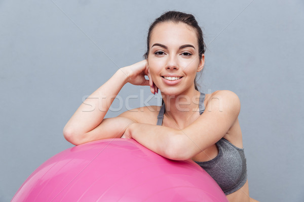 Close-up portrait of healthy fitness girl over grey background Stock photo © deandrobot