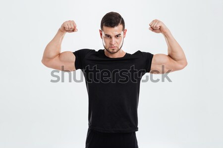 Gut aussehend junger Mann posiert gun Hintergrund Sicherheit Stock foto © deandrobot