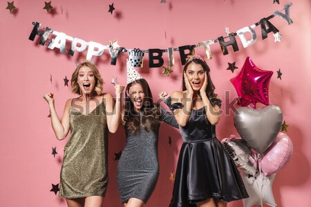 Stock photo: Happy women eating cupcakes and having fun on the party