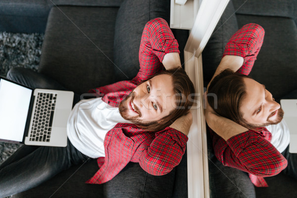 Felső kilátás boldog nyugodt férfi laptopot használ Stock fotó © deandrobot