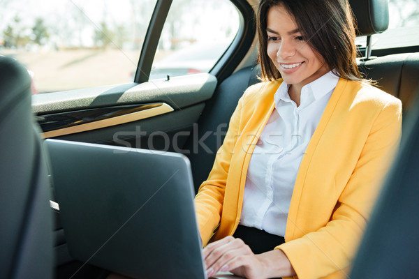 女實業家 坐在 背面 座位 汽車 工作的 商業照片 © deandrobot