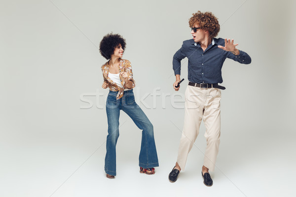 Emotional happy retro loving couple dancing. Stock photo © deandrobot