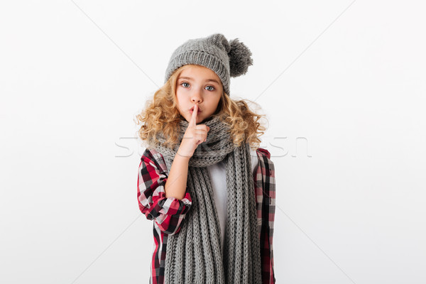 Portrait of a pretty little girl dressed in winter hat Stock photo © deandrobot