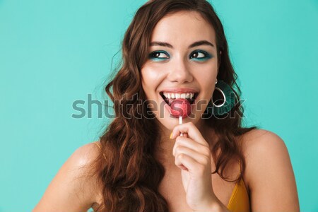 Portrait of a smiling brown haired woman Stock photo © deandrobot