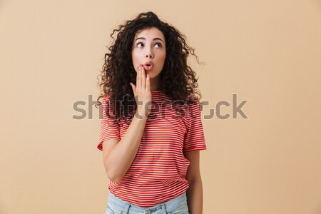 Amazed pretty woman in gray knitted sweater touching her face, l Stock photo © deandrobot