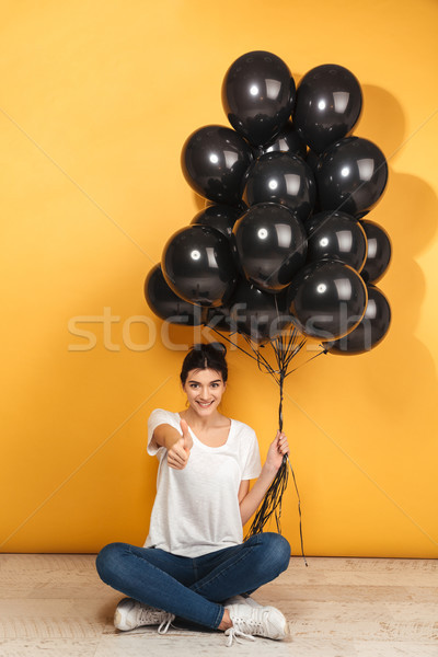 Portrait of a happy young woman Stock photo © deandrobot