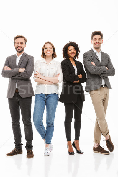 Full length portrait of a group of multiracial business people Stock photo © deandrobot