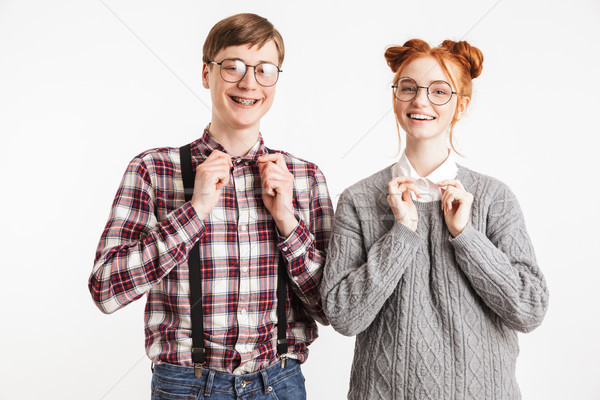 Happy couple of school nerds looking at camera Stock photo © deandrobot
