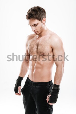 Back pain injury on fit adult man Stock photo © deandrobot
