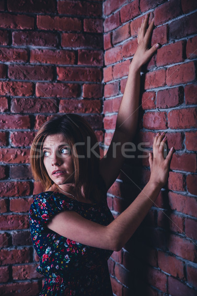 Portrait of a scared young woman Stock photo © deandrobot