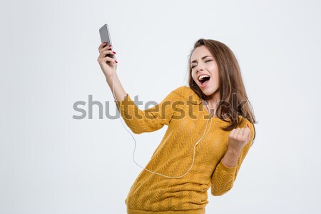 Stockfoto: Gelukkig · vrouw · luisteren · muziek · hoofdtelefoon · portret