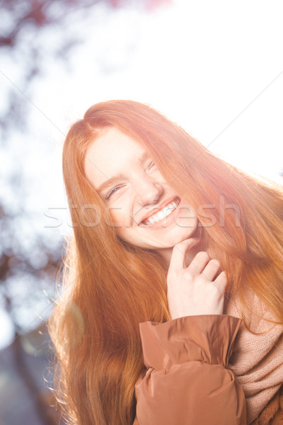 Funny redhead woman looking at camera Stock photo © deandrobot