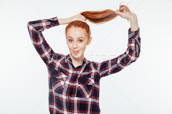 Frau halten Pferdeschwanz Rotschopf Zunge Stock foto © deandrobot