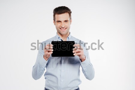 Stock photo: Happy business man showing blank tablet computer screen