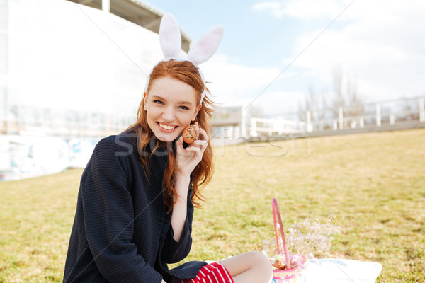 Portrait of a happy smiling girl with long ginger hair Stock photo © deandrobot