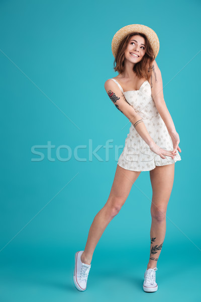 Smiling pretty dreaming girl posing and looking away Stock photo © deandrobot