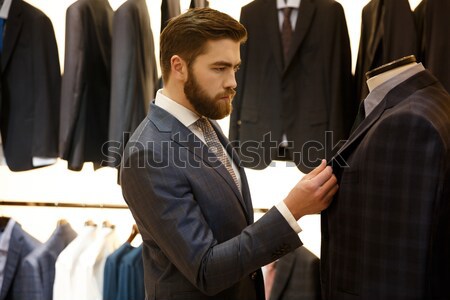 Man in suit posing  shop Stock photo © deandrobot