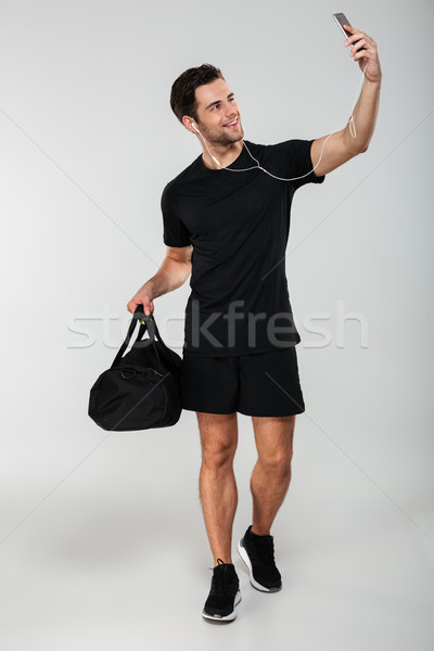 Foto stock: Alegre · esportes · homem · saco · telefone · móvel