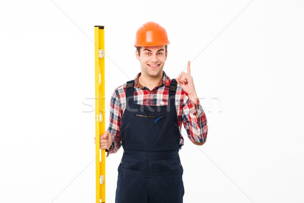 Portré mosolyog férfi egyenruha munkavédelmi sisak tart Stock fotó © deandrobot