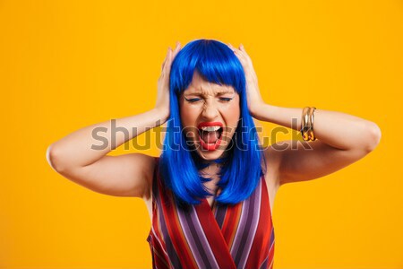 Image of young mulatto woman in colorful accessories being styli Stock photo © deandrobot