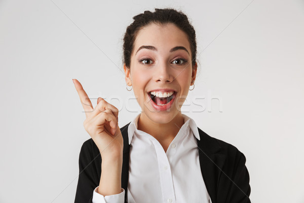 Excitado feliz jóvenes mujer de negocios senalando imagen Foto stock © deandrobot