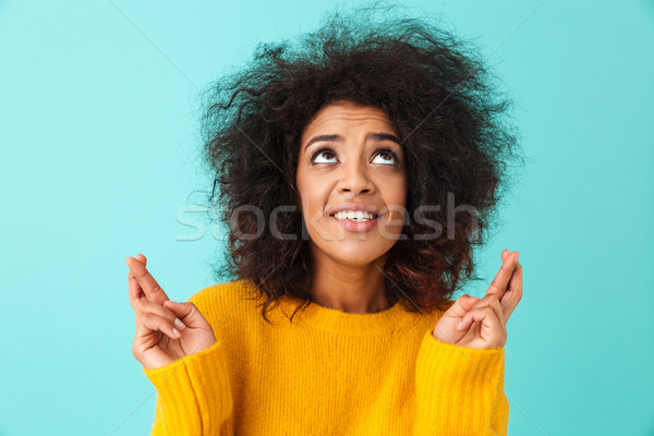 Praying concentrated woman wearing casual begging god please loo Stock photo © deandrobot
