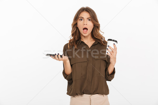 Portrait of a shocked young woman Stock photo © deandrobot