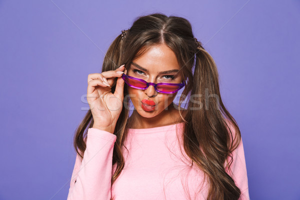 Portrait of a lovely girl in sweatshirt in sunglasses Stock photo © deandrobot