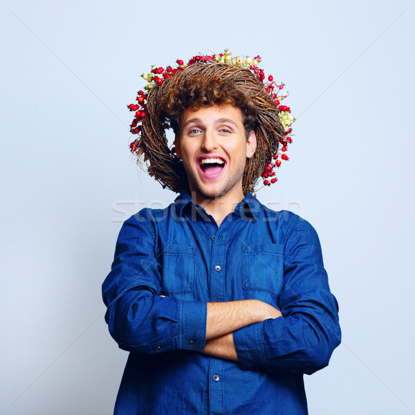 Portrait of a laughing funny man with wreath Stock photo © deandrobot