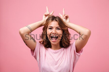 Smiling woman closing her eyes with round cookies Stock photo © deandrobot