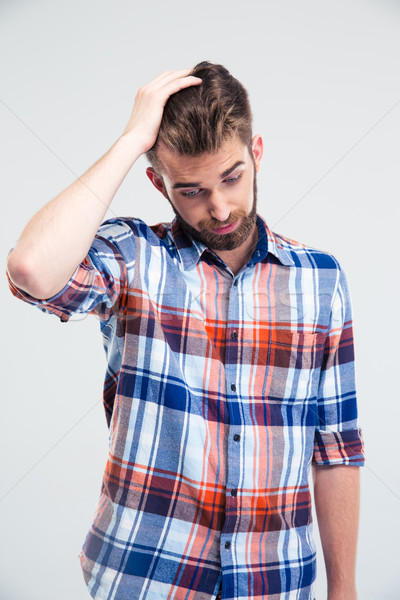 Portrait of a stressed young man  Stock photo © deandrobot