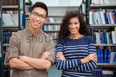 Students speaking in library  Stock photo © deandrobot