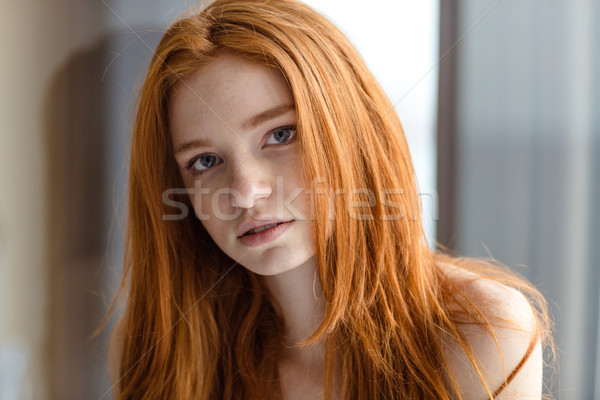 Redhead woman looking at camera Stock photo © deandrobot