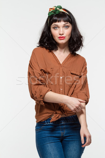 Piękna młoda kobieta bluzka dżinsy portret biały Zdjęcia stock © deandrobot