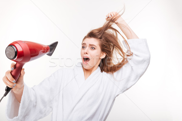 Grappig bange jonge vrouw haren bang badjas Stockfoto © deandrobot