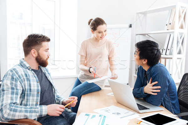 Businesspeople working and making new project in office together Stock photo © deandrobot