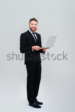 деловой человек ноутбука красивый бородатый Сток-фото © deandrobot