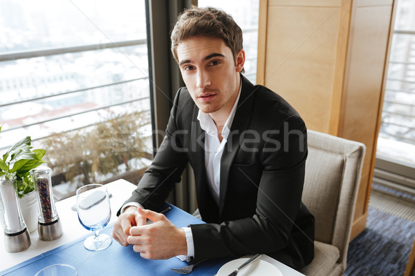 View from above of Man in restaurant Stock photo © deandrobot