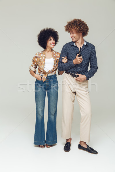 Emotional retro loving couple standing and posing Stock photo © deandrobot