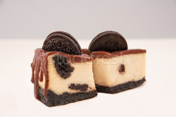 Two piece of cheesecake with cookies Stock photo © deandrobot