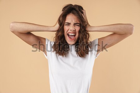 Confused screaming young displeased woman Stock photo © deandrobot